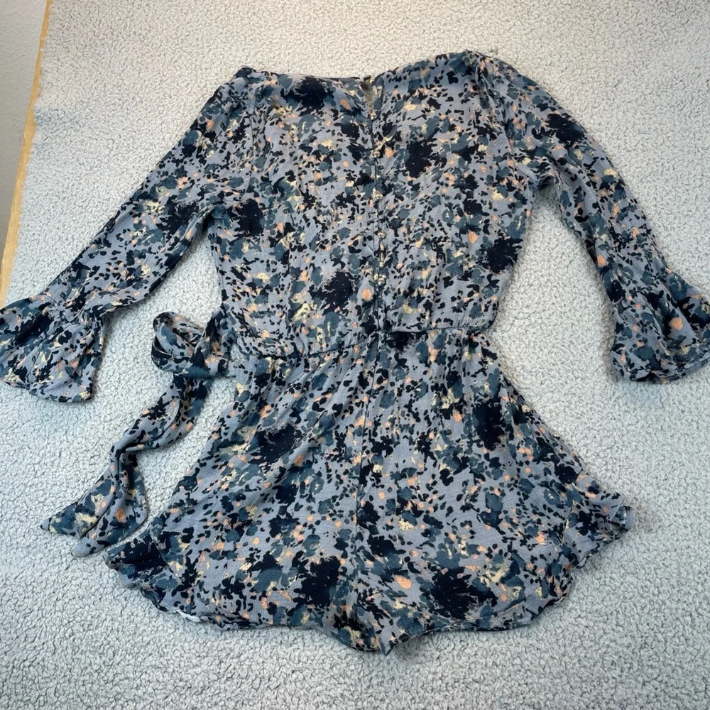 Free People‎  Romper Womens Small  All The Right Ruffles Raven Combo Button Back